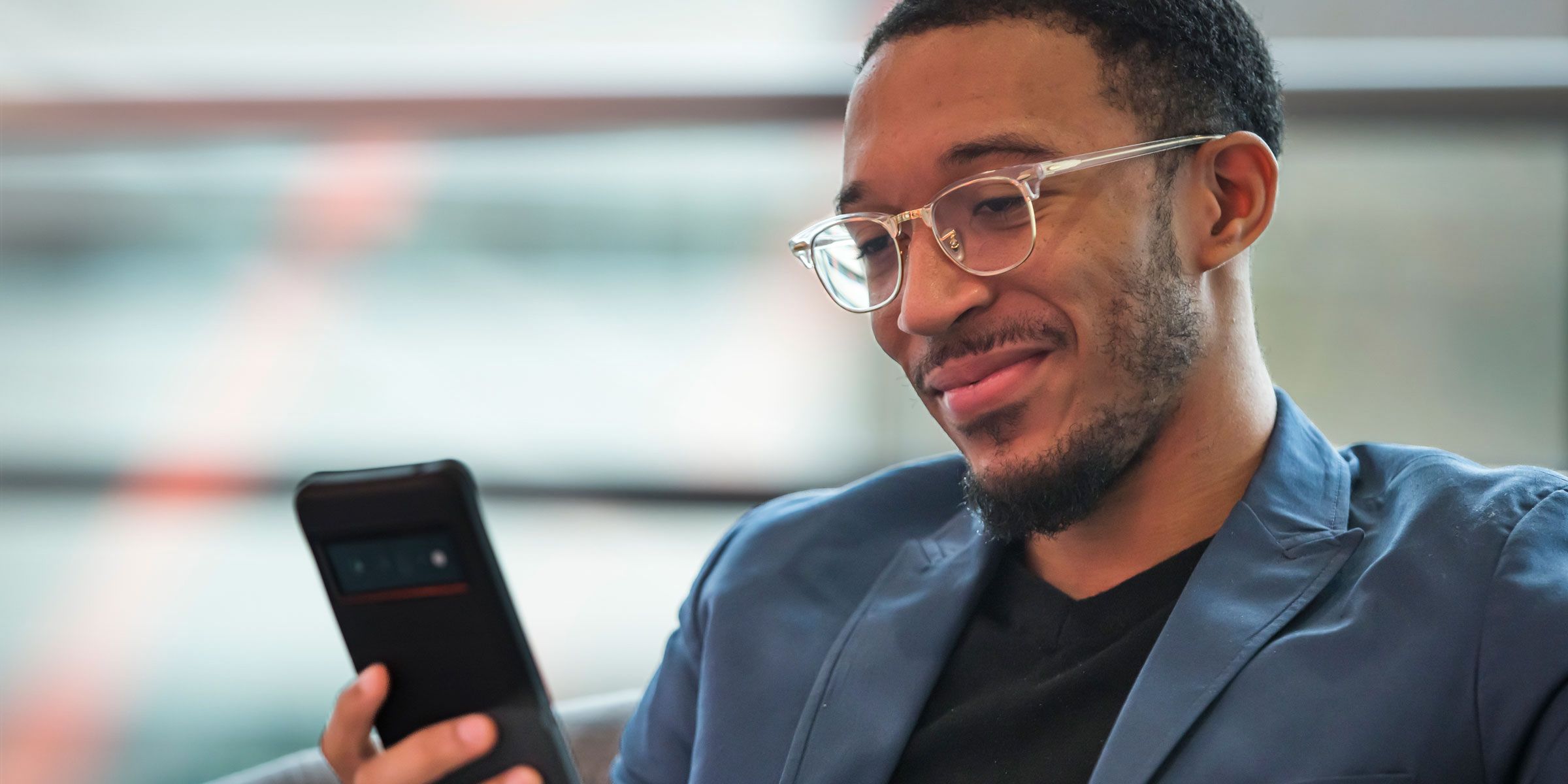 man looking at a smart phone